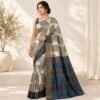 Cream Tussar Silk Saree with black geometric motifs and blue border